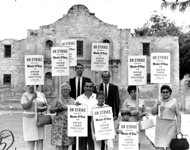 Photo of people picketing in front of the Alamo