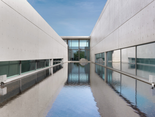 Image of courtyard within concrete art museum and reflecting pool