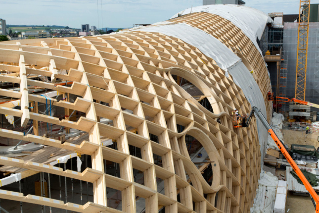 Construction photo of a gridded wooden structure