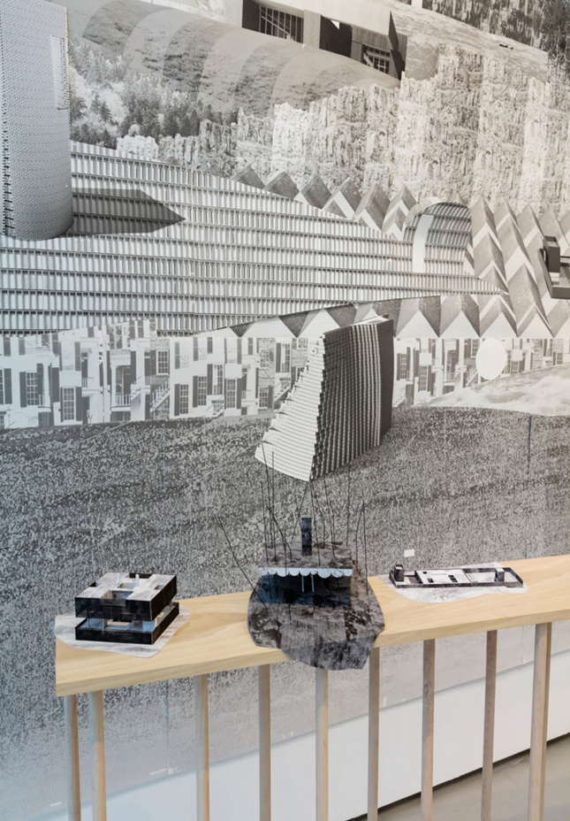 Installation view of building rendering and models