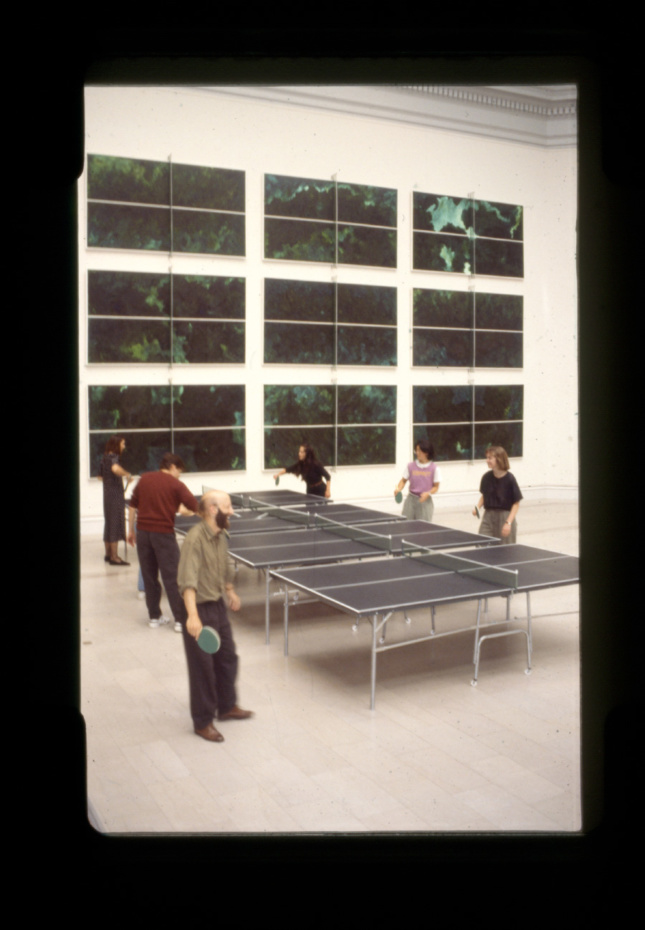Black-and-white photo of people playing ping-pong