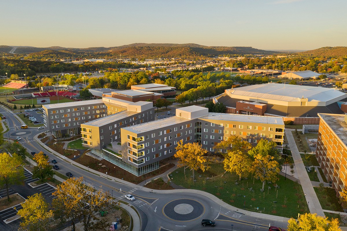 Aerial view of the University of Arkansas campus residential hall at sunset