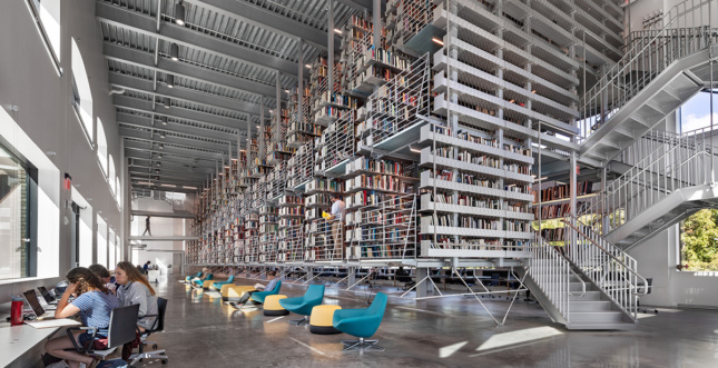 Interior daylight shot of steel library stacks and seating 