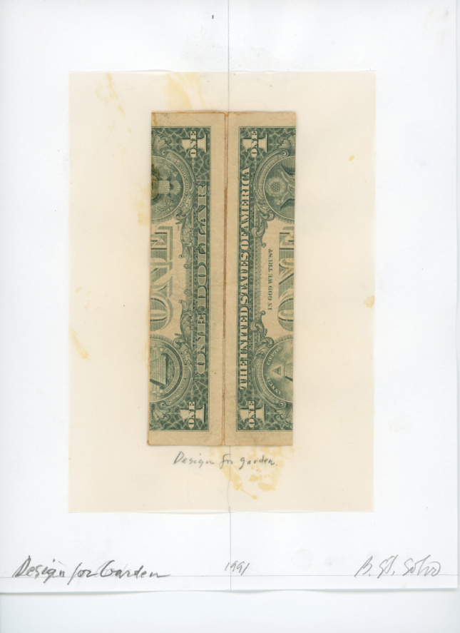 A rolled up and mounted dollar bill