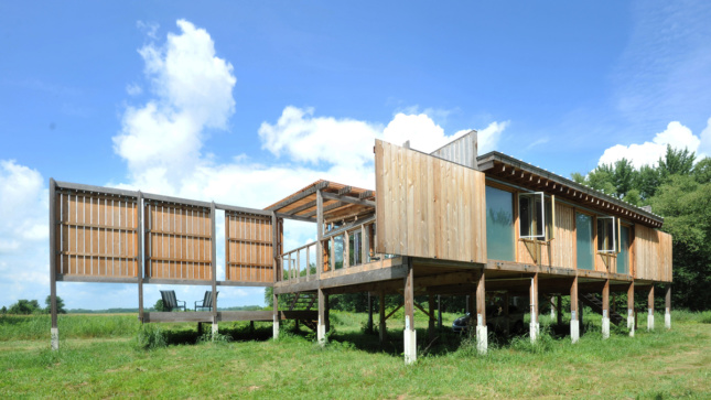 the exterior of a wood-clad elevated house