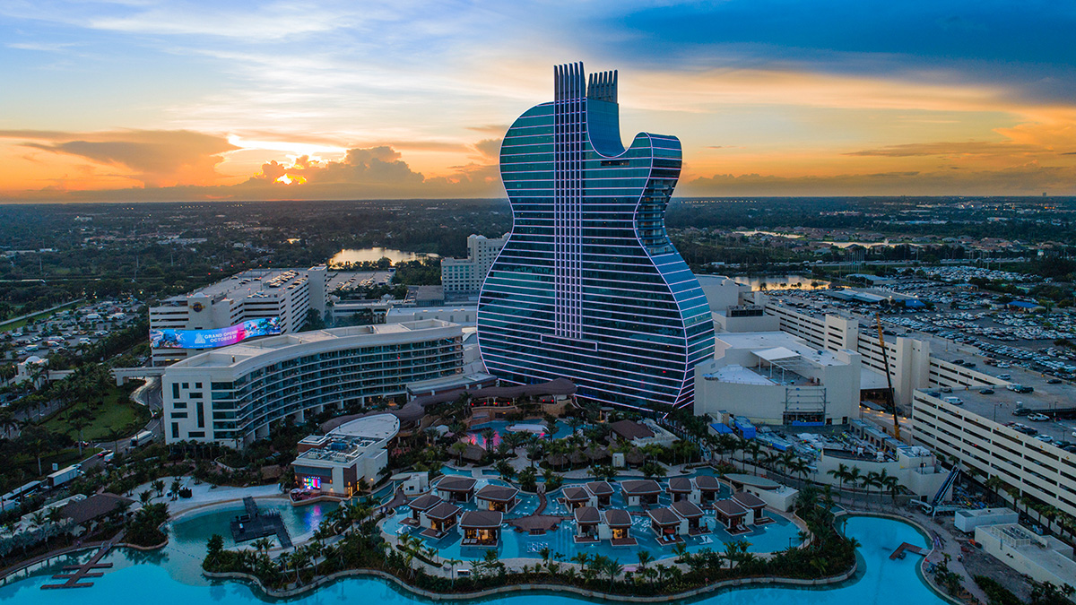 Aerial view of the Hard Rock guitar-shaped hotel and resort at sunset
