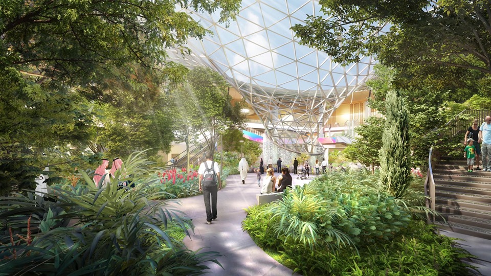 Rendering of nature-filled, airport hub with interior waterfall at the Hamad Airport