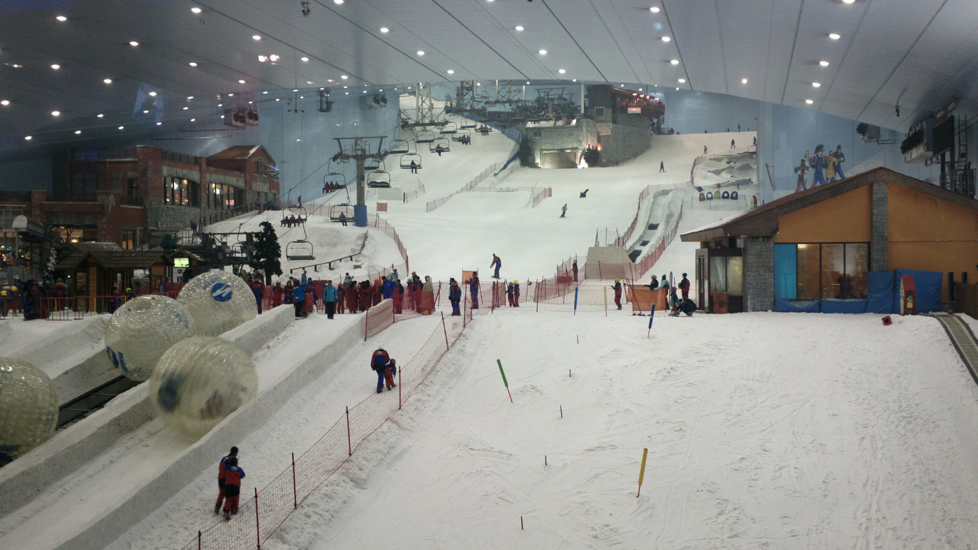People skiing on an indoor ski slope