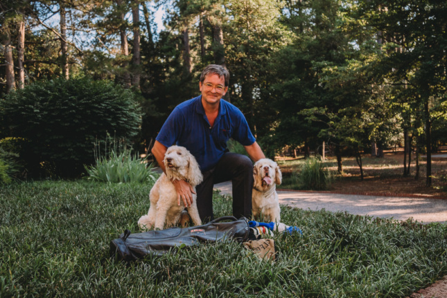 Image of man with two dogs 