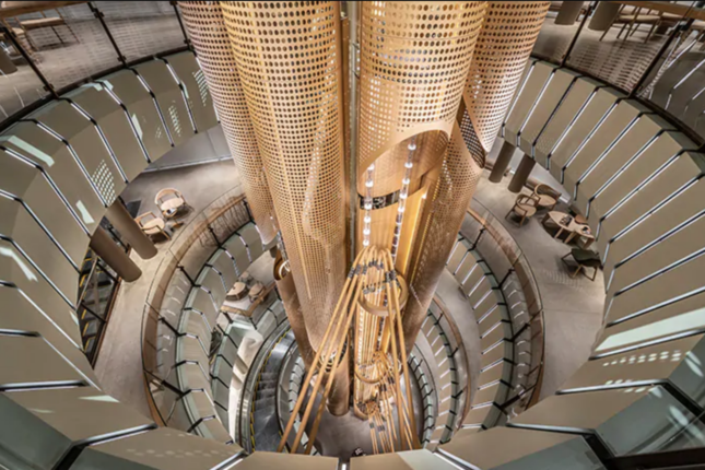 Interior shot looking down at coffee bean cask and spiraling escalator