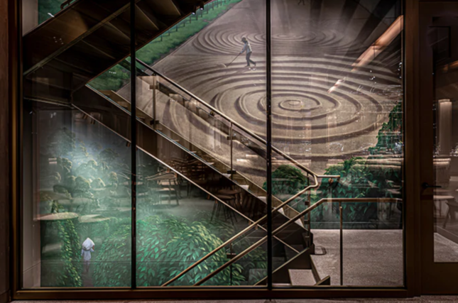 Image of staircase against mural inside of a Starbucks