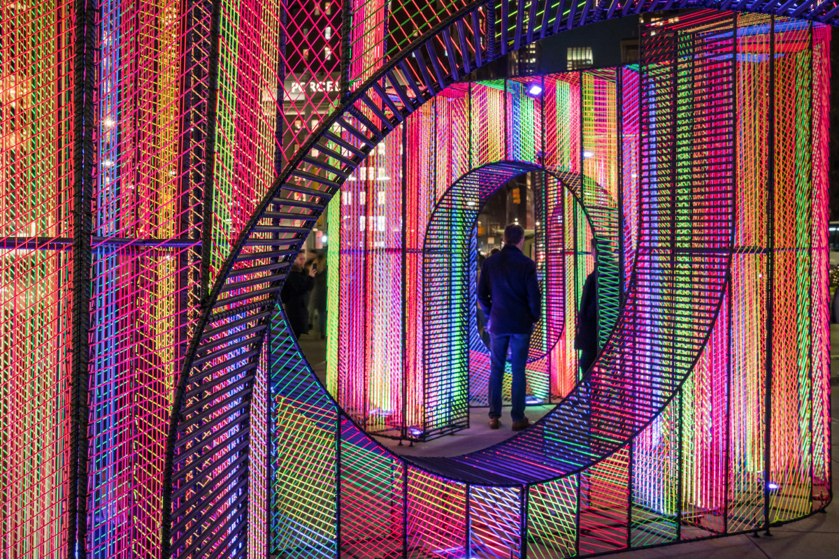 Installation view of the Flatiron Holiday Design pavilion, a swirling string structure