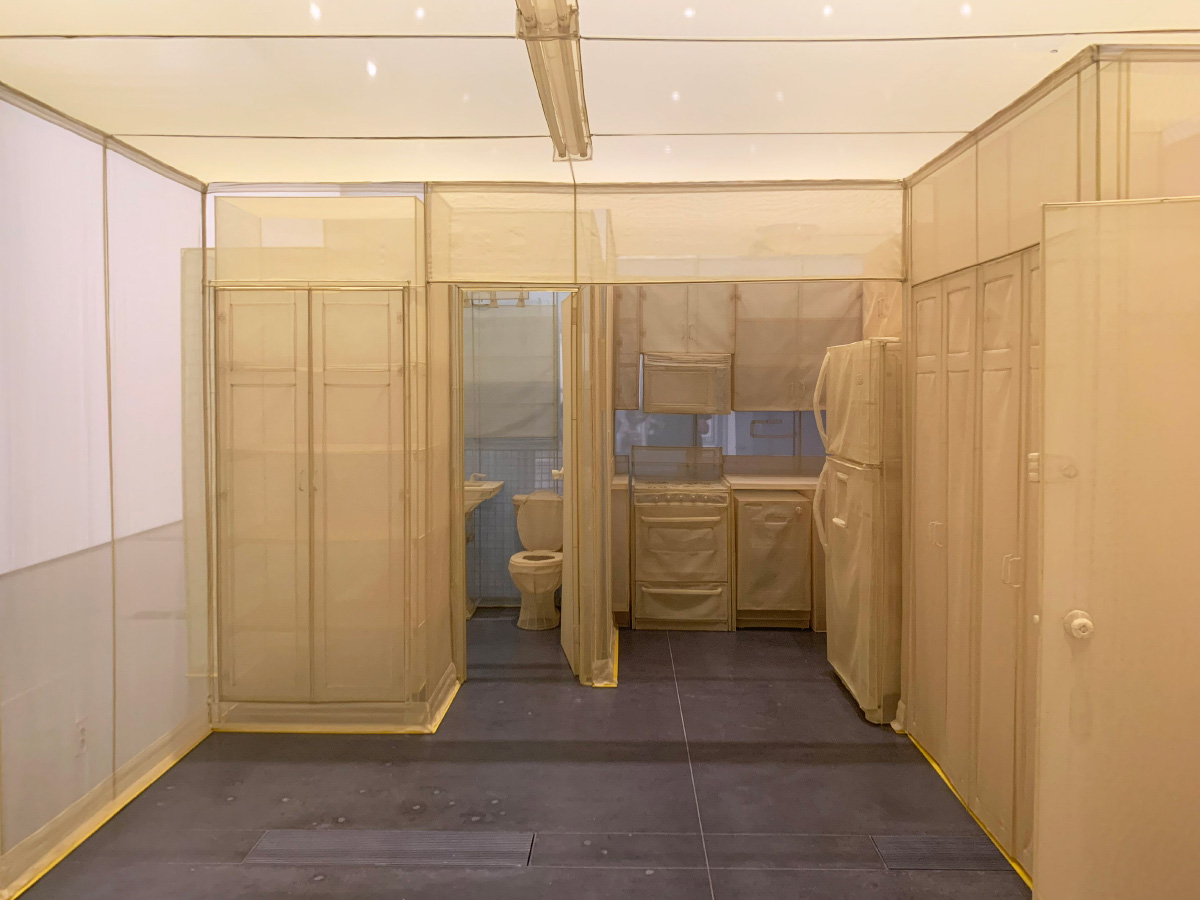 Interior photo of an apartment unit made from yellow fabric by Do Ho Suh