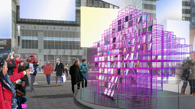 A side view of a pink steel-frame cubic sculpture with mirrors in Times Square