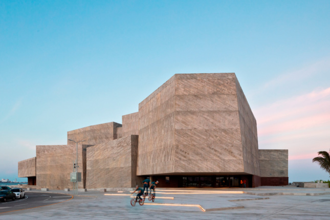 A concrete concert hall with solid windowless forms