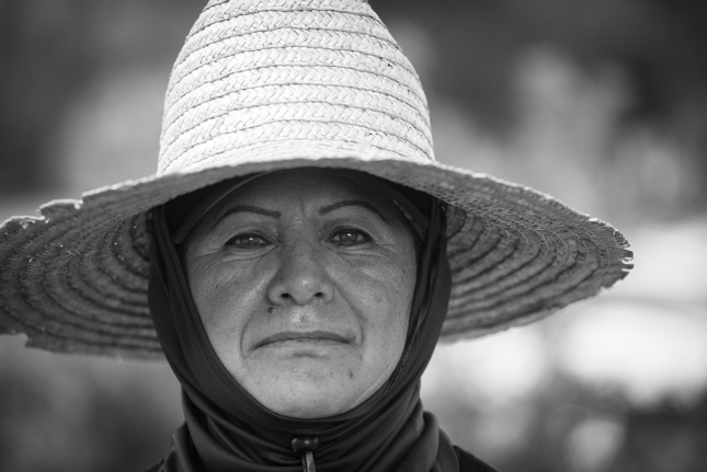 Close up image of construction worker with straw hat 