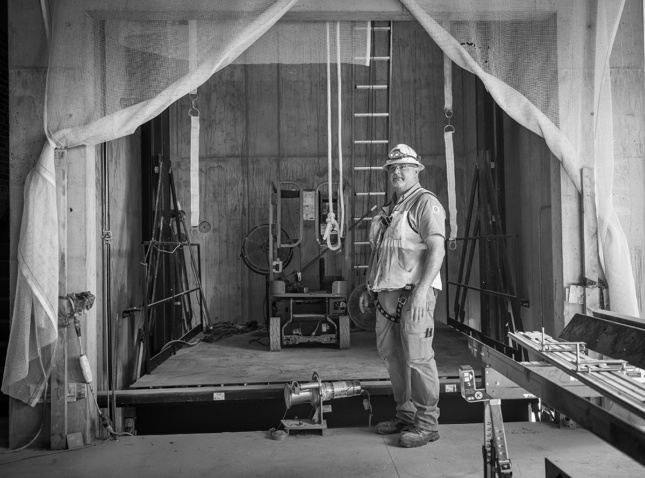 Construction worker standing inside building under renovation