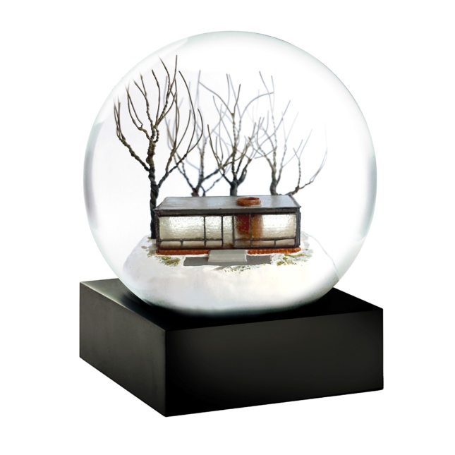 A snowglobe with the glass house inside