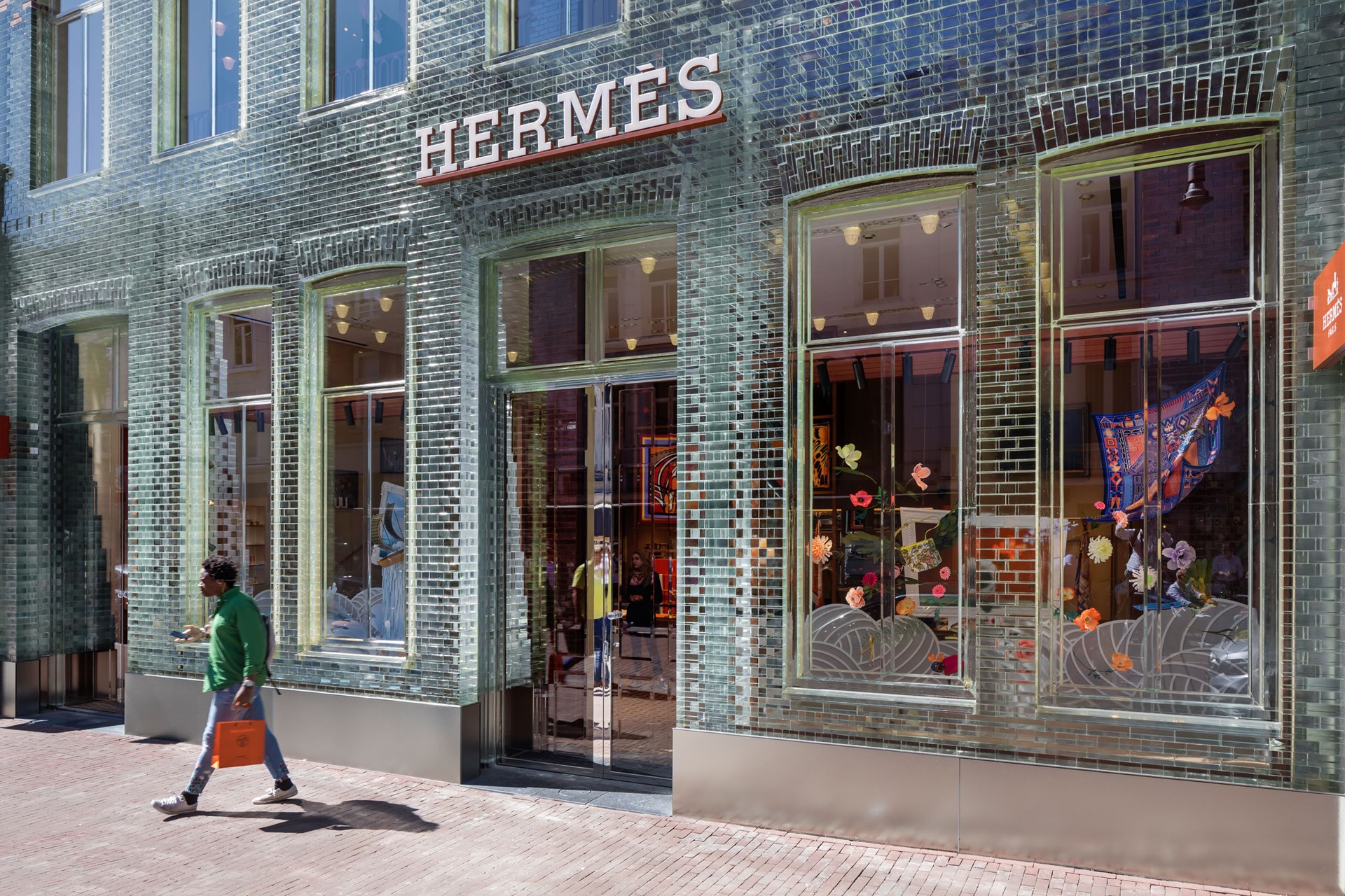 A glass storefront with an Hermes sign, presented at Facades+ L.A. 2019