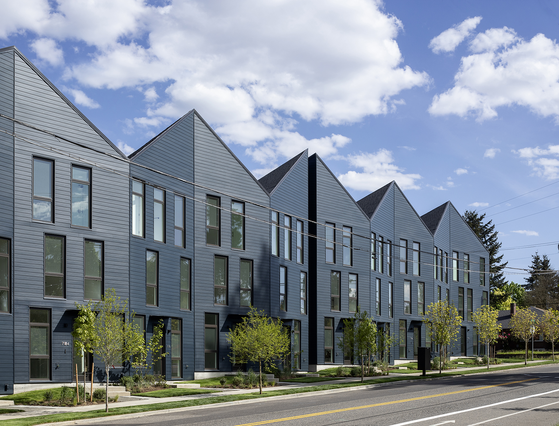 Exterior shot of origami-inspired townhouses in Portland clad in timber