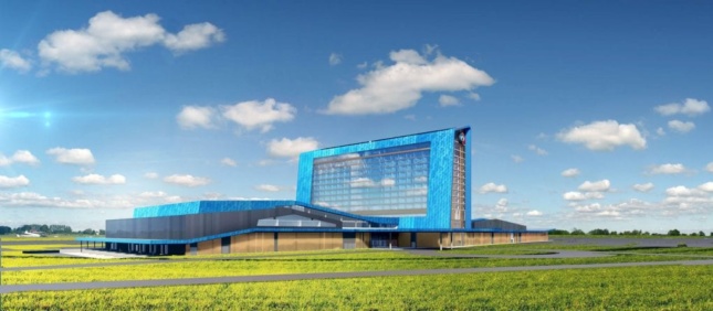 A rendering of bright blue Saracen Casino Resort in a grassy field