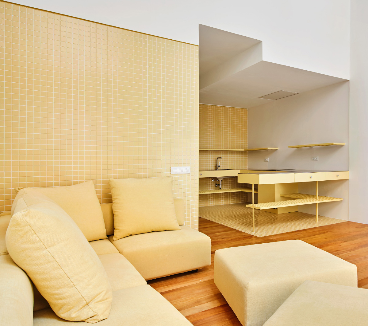 Interior of an apartment complex with gold-tiled walls