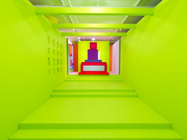 A long green hallway with steps in Heterotopia