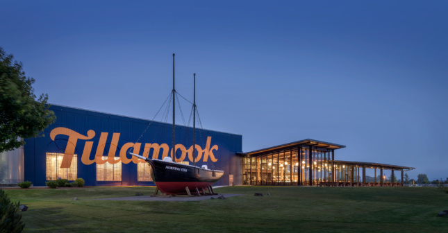 A short blue building with Tillamook written on the side