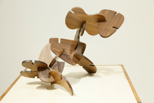 A wooden chair assembled from pieces