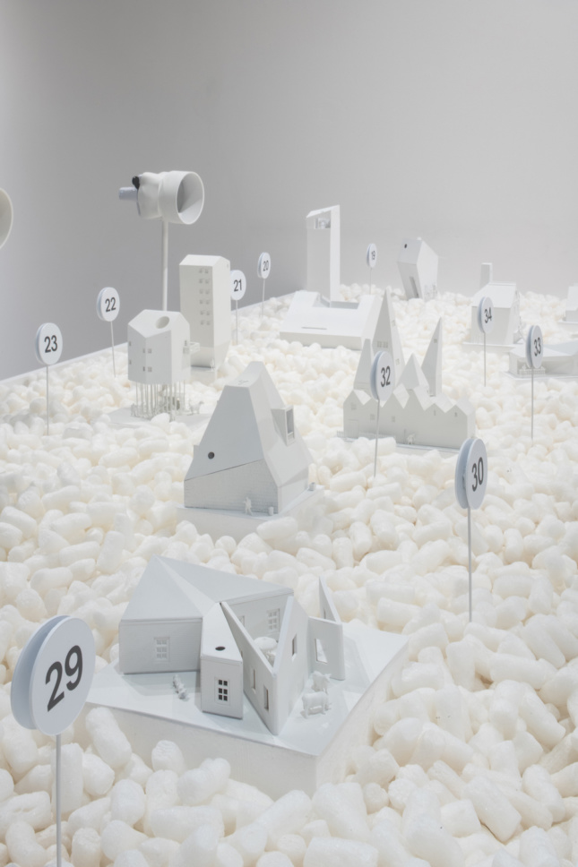 White architectural models floating in a gallery for Swissness Applied