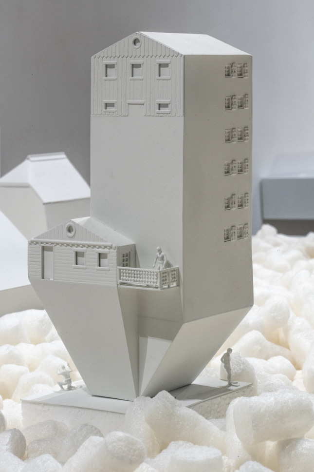 White model of a building sloping down at the bottom for Swissness Applied