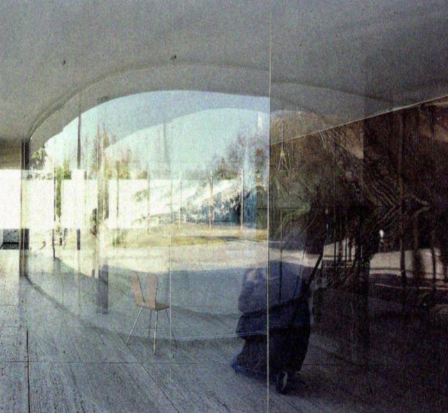 Photograph of curved clear walls in an enclosed pavilion