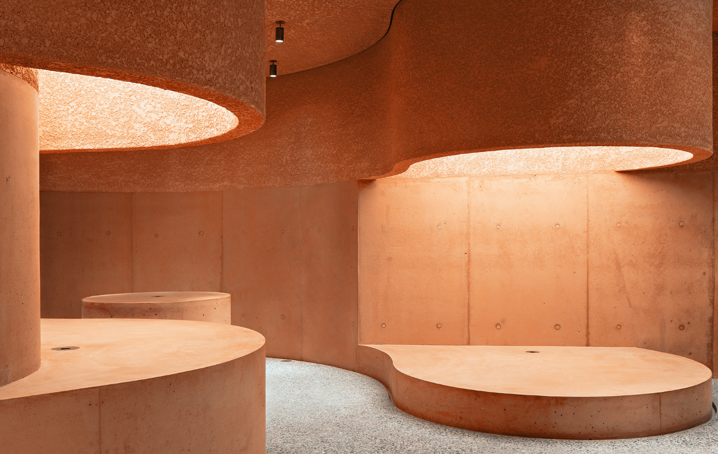 Interior of a pink concrete retail store for The Webster