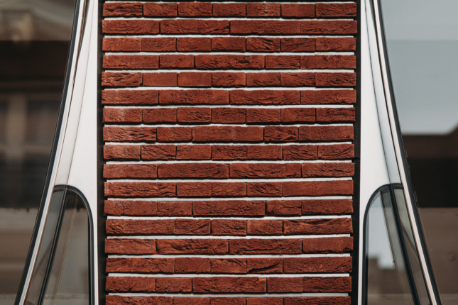 Detail of reddish-brown brick slips