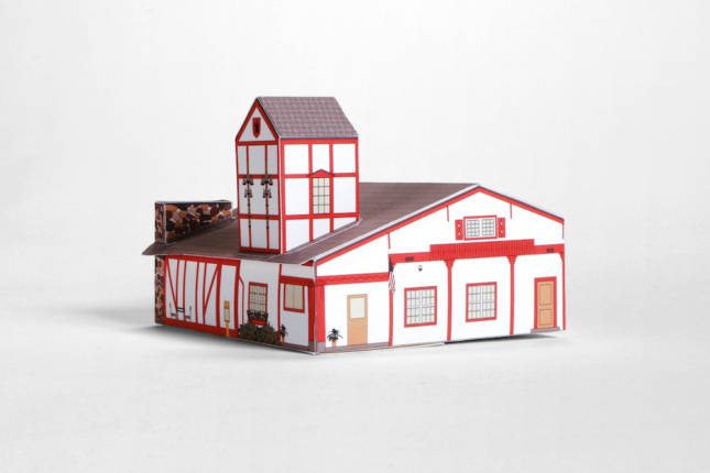 A paper model of a Tudor-style house in Swissness Applied