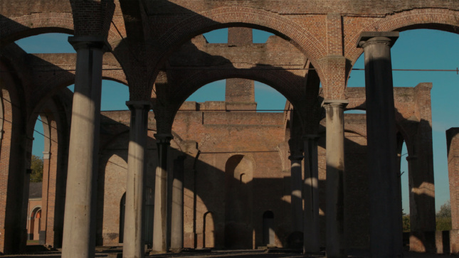 Video still of brick arches from Fiona Tan