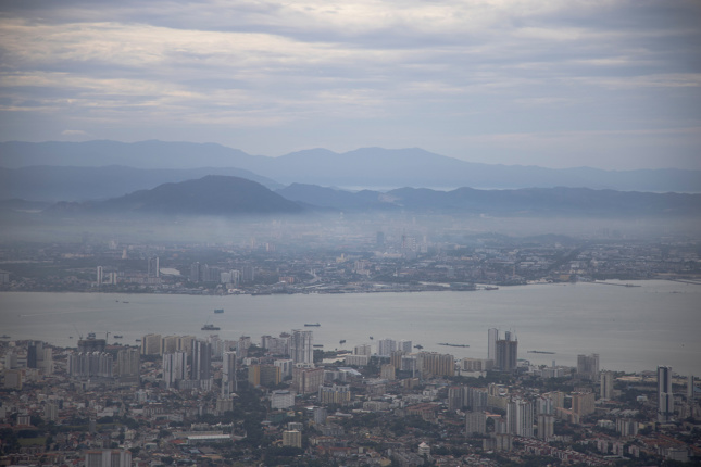 Aerial and foggy view of Penang by the sea, the site of the new artificial islands