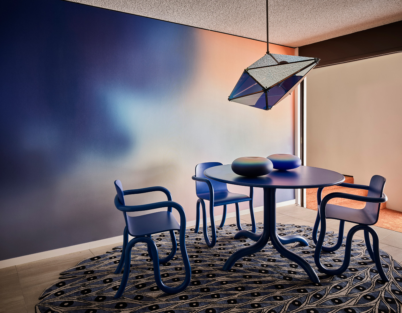 Interior of a Future Perfect showroom showing a blue wall and geometric lamp