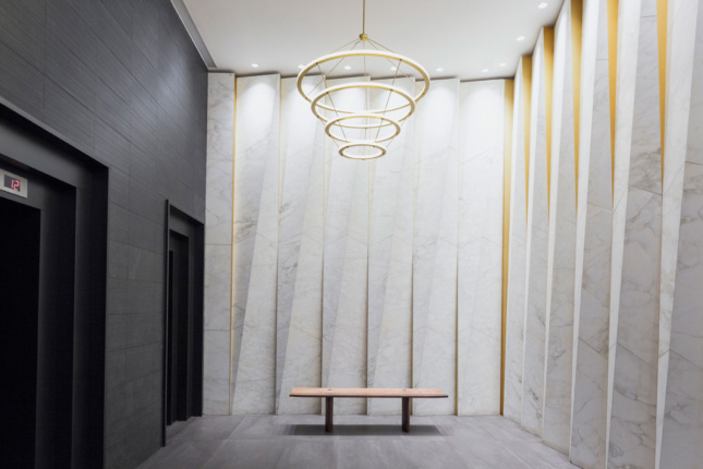 Interior photo of a lobby decked out in pleated marble