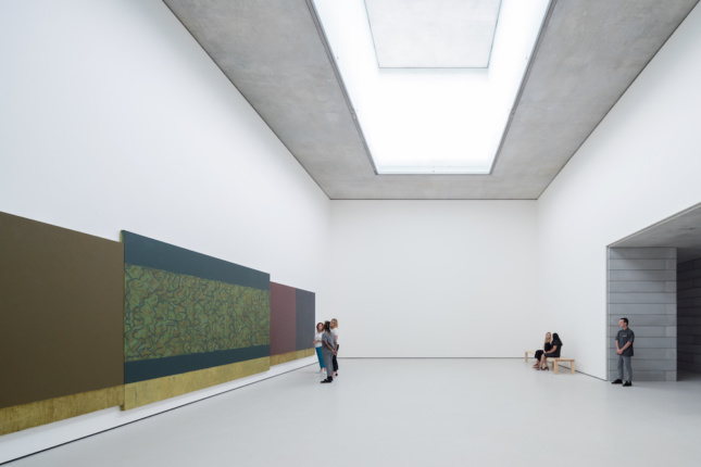 Photo of gallery space with a large skylight above