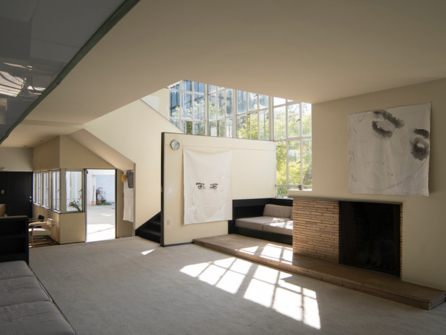 interior space with artwork and fireplace