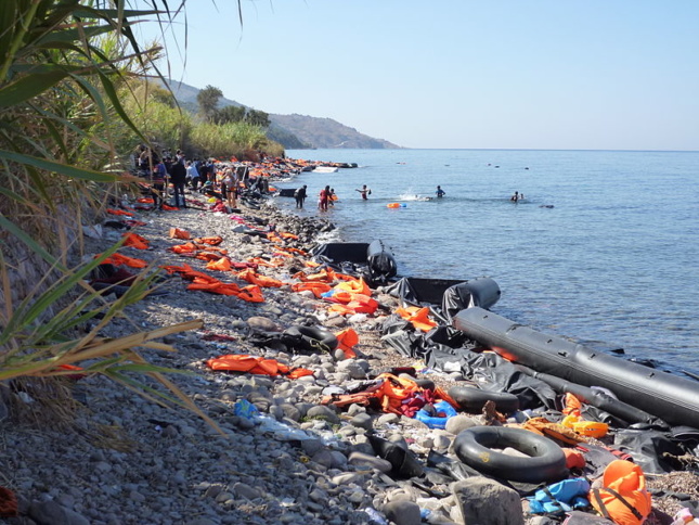 a lifejacket-littered beach in Lesbos, Greece