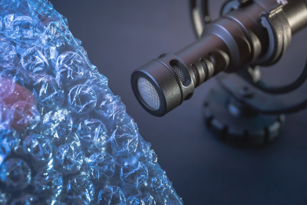 Bubble wrap in front of a microphone as part of an ASMR setup