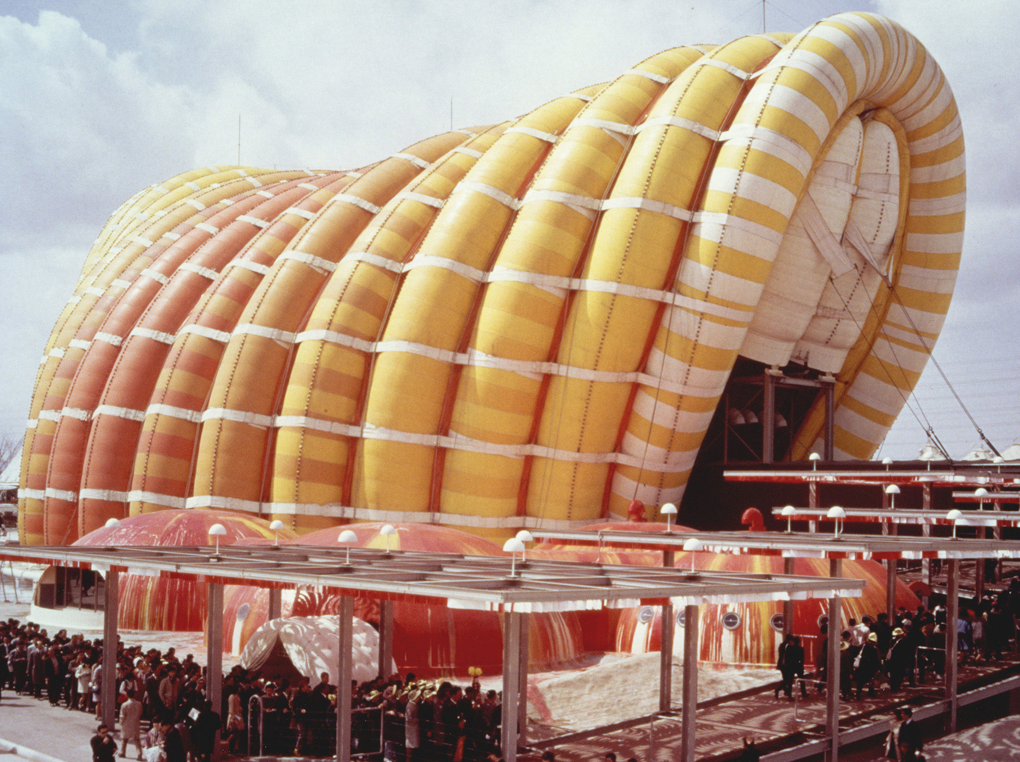 A large yellow and orange inflatable structure built in Japan