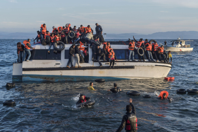 Refugees arrive by boat in Greece's Aegean Islands