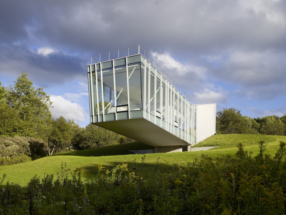 a cantilevered house in a rural landscape