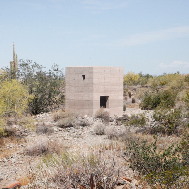 A square concrete bunker in the desert of Taliesin