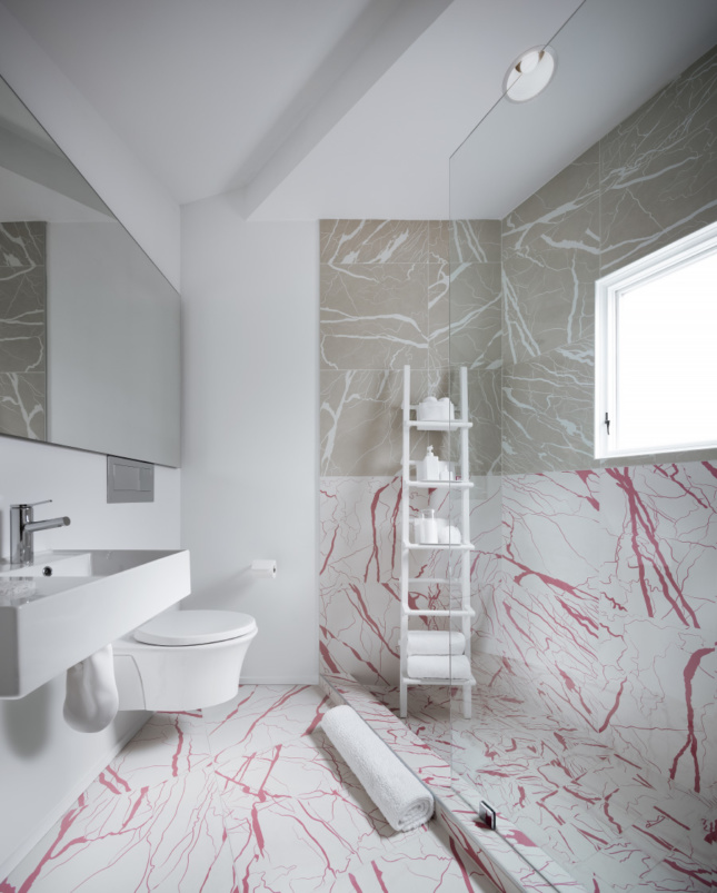 Interior of a bathroom with fake marble, designed by Jennifer Bonner