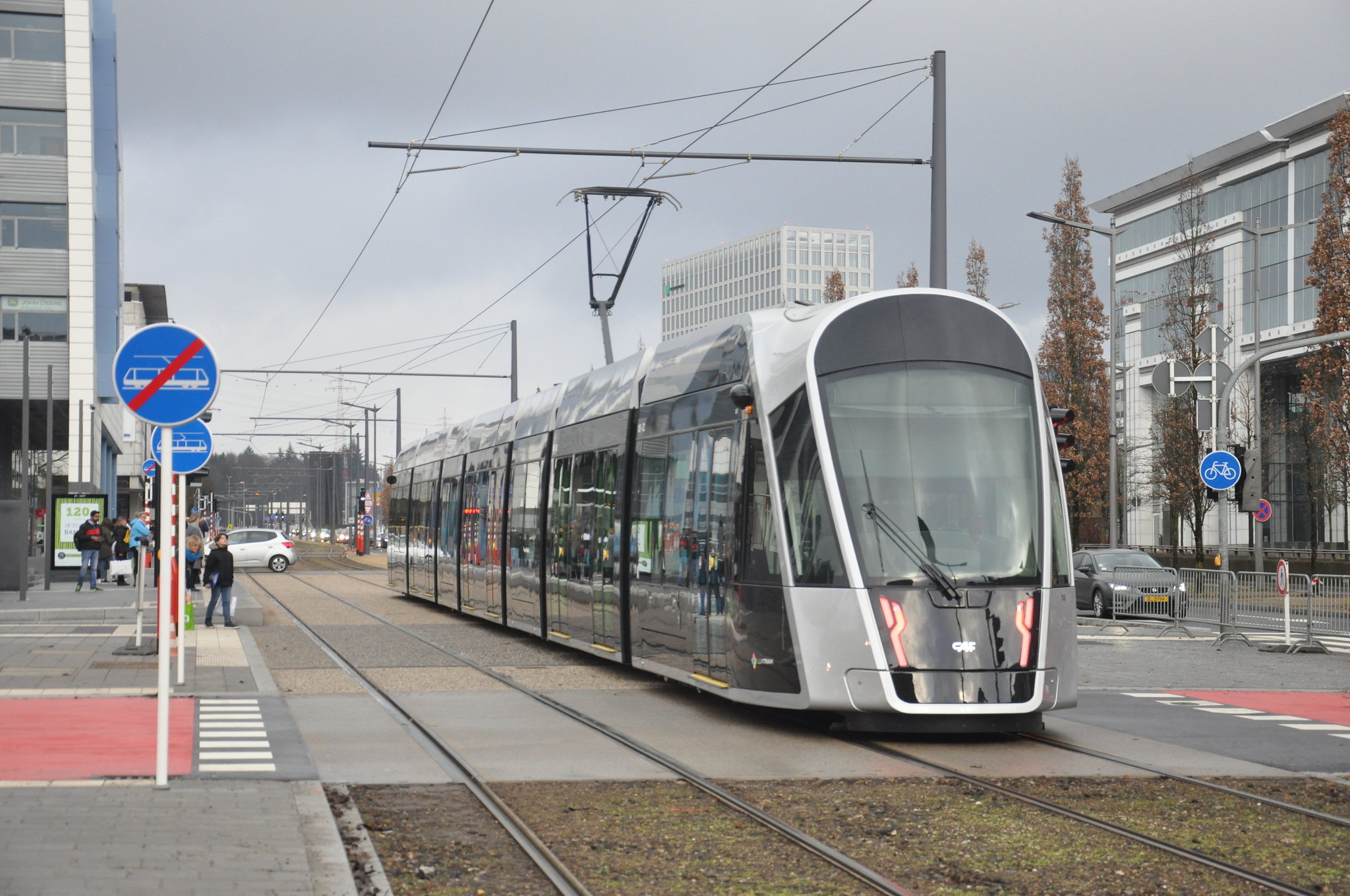 a modern tram moves through a city