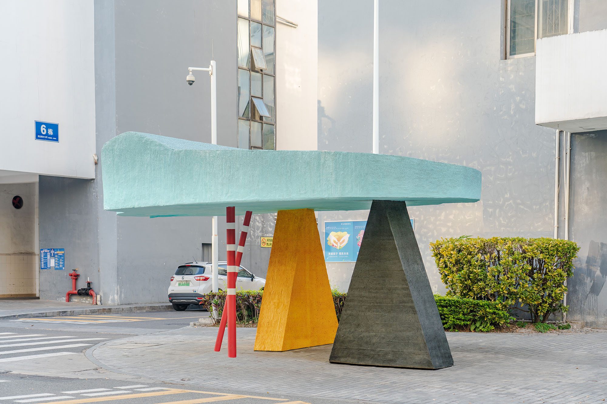 Object on a street corner, a triangular shelter designed by Sam Jacob Studio